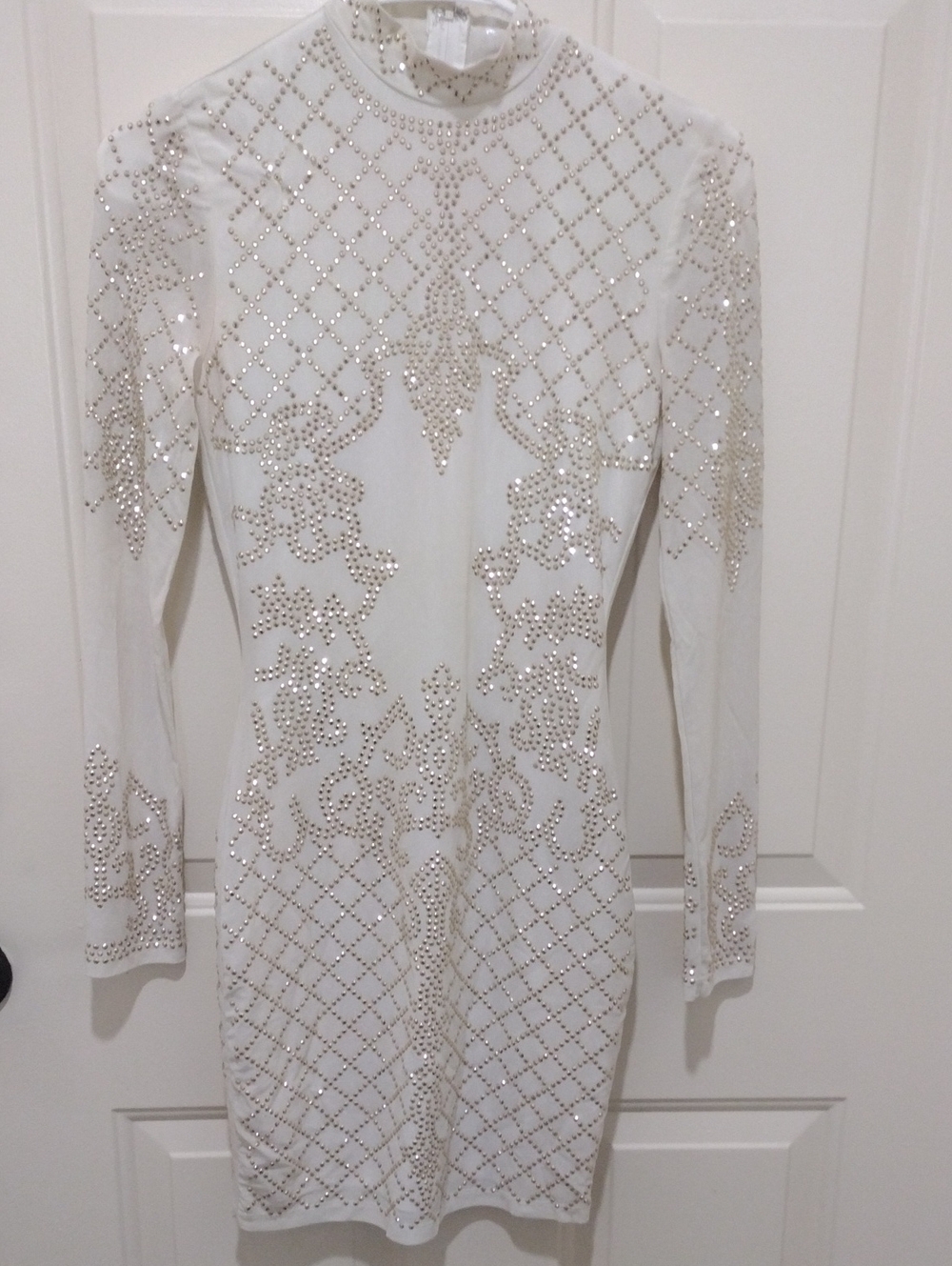Woman's Elegant Ivory And Gold Mini Dress With Beaded Embellishments.